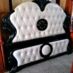 navy blue bed with bookshelves