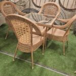 wicker swing chair with plush cushions