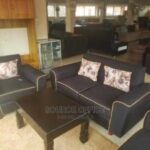 stylish beige couch wood accents
