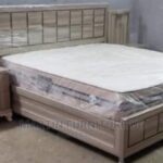 beige study bed with cabinet
