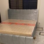 black tufted workspace bed