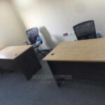 facing office desk for two people