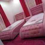 king tufted upholstered bed