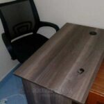 shared desk with glass divider panels